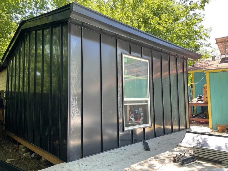 Black standing seam metal wall panels for Roof Inspection in Inglewood